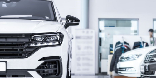 Front view of a white SUV highlighting grille and headlight design
